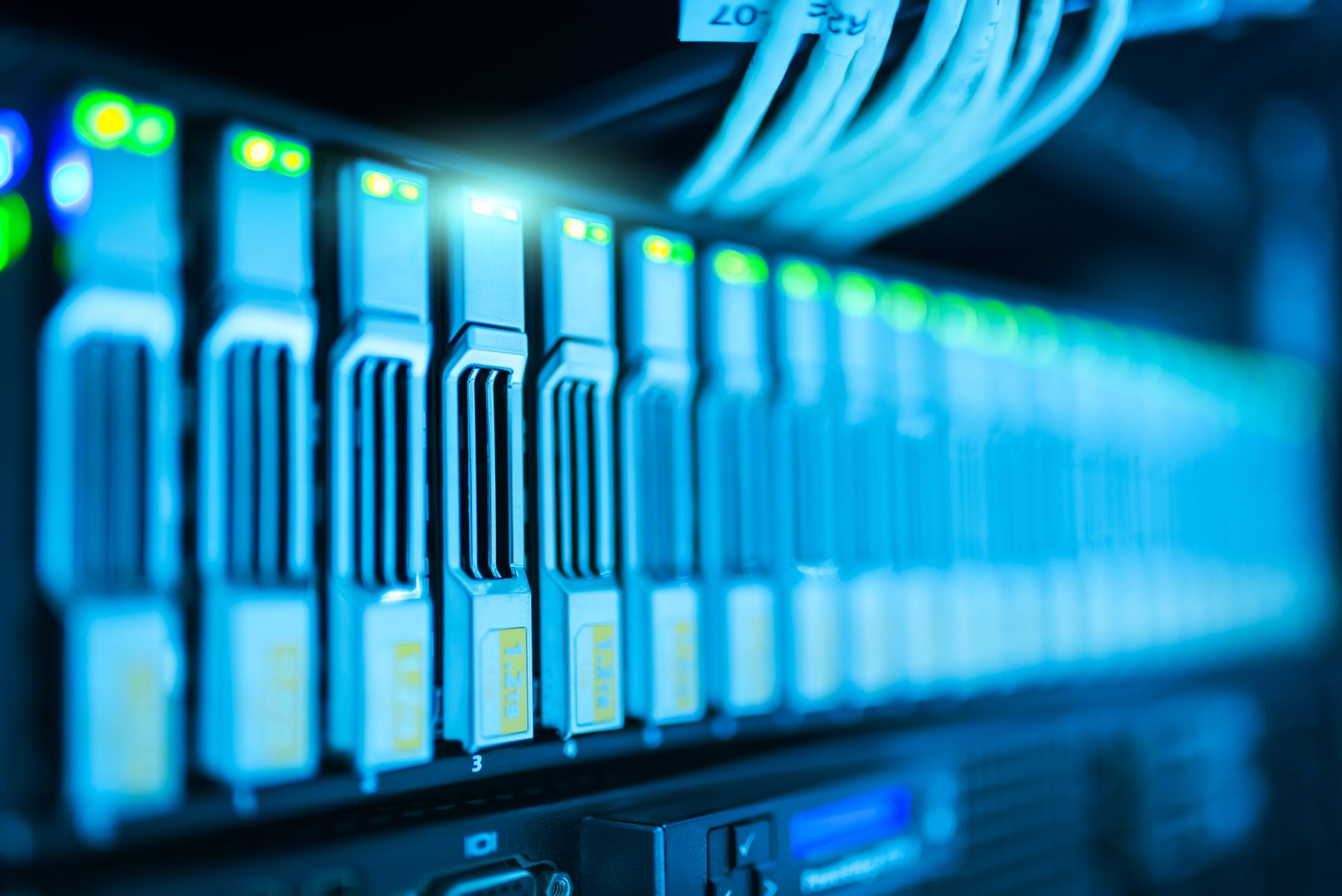 Server racks and network cables in a data centre.